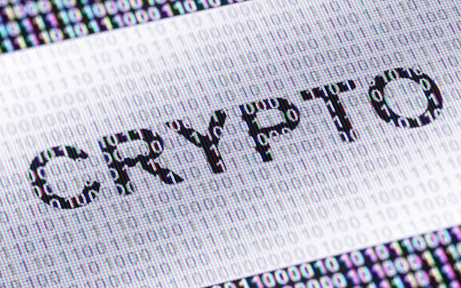 A close-up digital display reading “CRYPTO” highlights how modern digital assets are evaluated under the Howey Test., which is used to outline cryptocurrency compliance.