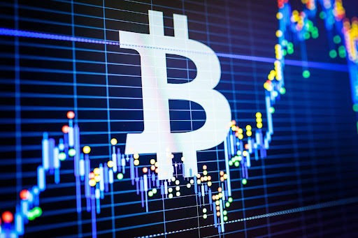 A stock exchange chart with a large Bitcoin logo superimposed; many businesses have adapted to accept payments in crypto.